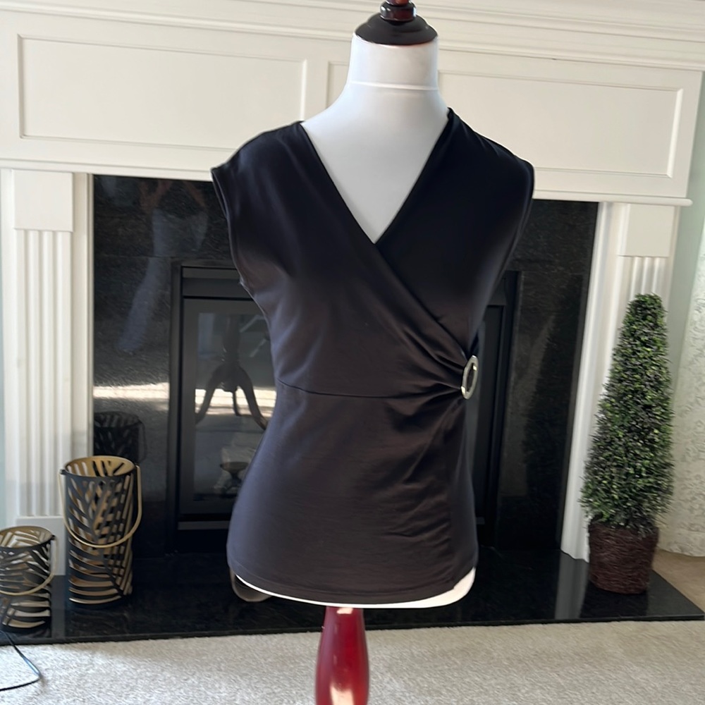 Friday night out on the town. Black sleeveless top, v neck. Size PP hip length